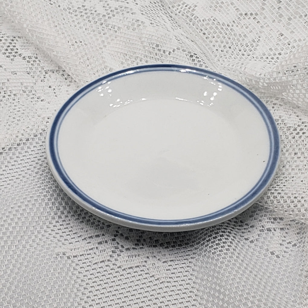 Small blue and white butter plates