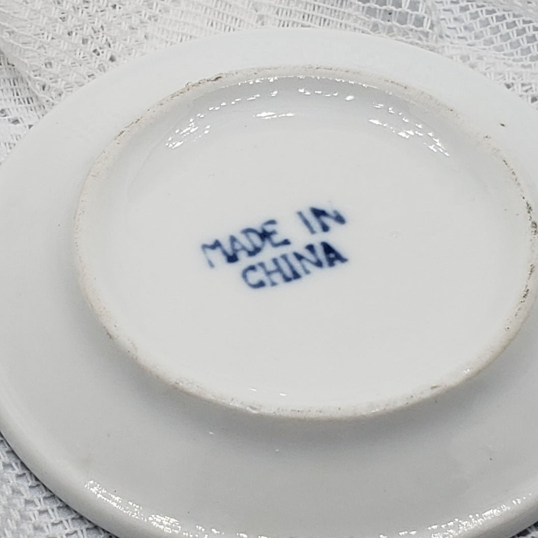 Small blue and white butter plates